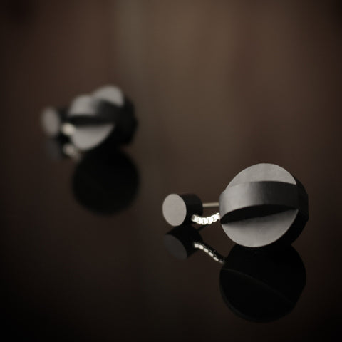 Cruinn - Interlocking sphere shaped wooden drop earrings in black, on sterling silver chain. Handmade in Ireland by jewellery designer Rowena Sheen 